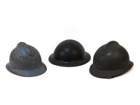 Lot 1445 - Three early 20th century enamelled helmets