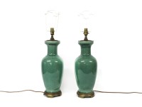 Lot 1406 - A pair of modern celadon table lamps with pleated cream shades