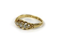 Lot 1177 - An 18ct gold boat shaped five stone graduated diamond ring
2.23g