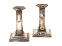 Lot 1276 - A pair of silver candlesticks