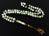 Lot 1105 - A single row moss agate bead necklace