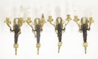 Lot 515 - A set of four ormolu twin branch wall lights