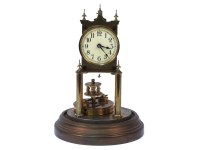 Lot 1482 - A brass anniversary clock