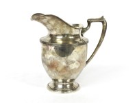 Lot 1275 - A sterling silver water jug