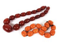 Lot 1202 - A single row graduated olive shaped Bakelite bead necklace