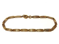 Lot 1129 - A two colour gold panel bracelet