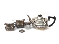Lot 1228 - A silver three piece tea set by Harrison Fisher & Co