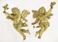 Lot 550 - A pair of carved gilt wood putti