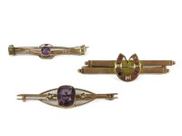 Lot 1188A - Two gold amethyst and split pearl bar brooches