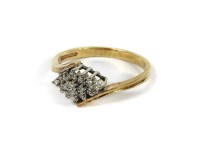 Lot 1188 - A 9ct gold lozenge shaped diamond crossover ring