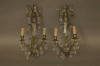 Lot 1523 - A pair of brass and glass wall lights