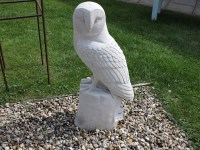 Lot 3040 - A cast stone sculpture of a giant barn owl