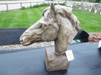 Lot 3054 - A cast stone sculpture of a horse's head