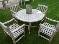 Lot 3001 - A Barlow Tyrie circular hardwood garden table and four chairs. 109cm diam.