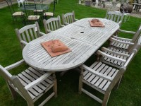 Lot 3002 - A Barlow Tyrie hardwood garden table and eight chairs