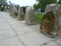 Lot 3083 - A set of six carved limestone staddle stone bases of square spreading form