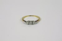 Lot 1006 - A gold three stone diamond ring