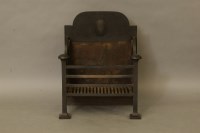 Lot 2015 - An Arts and Crafts cast iron fire grate