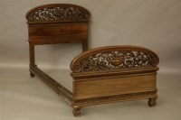 Lot 2057 - A 19th century Continental carved walnut single bedstead