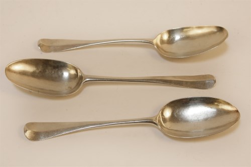 Lot 1039 - Three early 18th century silver table spoons