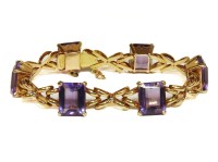 Lot 1025 - A gold emerald cut amethyst bracelet
