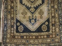 Lot 2058 - An antique Middle Eastern blue ground rug