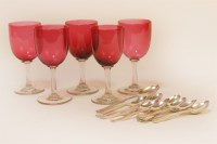 Lot 1052 - A collection of hallmarked silver teaspoons and a set of five cranberry glasses (qty)