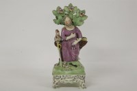 Lot 1139 - A Staffordshire table base pearlware figure of St Peter