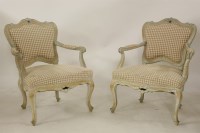 Lot 2201 - A pair of Louis XVI painted and part stripped open armchairs