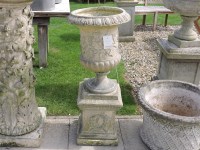 Lot 3023 - A garden urn and plinth