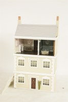 Lot 1582 - A three storey Tudor style doll's town house