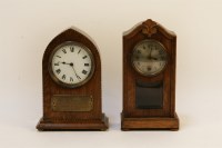 Lot 1150 - An oak and chequer strung lancet clock