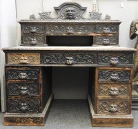 Lot 2093 - A Victorian carved oak lion's head desk 122cm