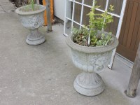 Lot 3163 - A pair of reconstituted stone urns