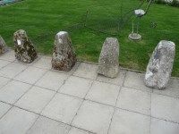 Lot 3098 - A set of four carved limestone staddle stone bases of square spreading form