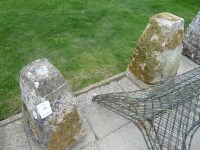 Lot 3099 - A pair of carved limestone staddle stone bases of square spreading form