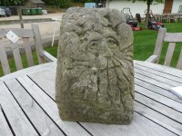 Lot 3044 - A hand carved salvaged corner stone of a green man