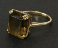 Lot 93 - A 9ct gold scissor cut smokey quartz ring