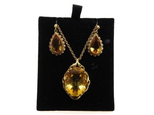 Lot 1003 - A 9ct gold single stone oval cut citrine pendant