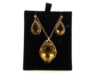 Lot 1003 - A 9ct gold single stone oval cut citrine pendant