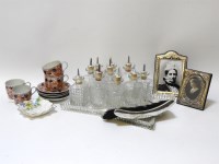 Lot 1296 - Two silver and velvet backed photograph frames together with four Imari decorated tea cups and saucers dressing table bottles and silver backed brush