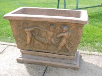 Lot 3026 - A terracotta planter on a stand