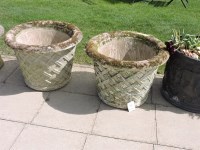 Lot 3123 - A pair of haddonstone circular tapering planters