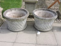 Lot 3124 - A pair of haddonstone circular tapering planters