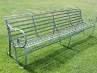 Lot 3015 - An iron slatted garden bench