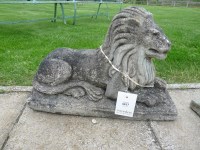 Lot 3017 - A pair of composition stone lions