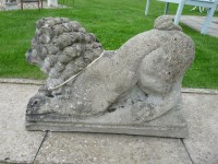 Lot 3018 - A pair of composition stone lions