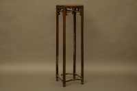 Lot 2068 - A Chinese hardwood jardiniere stand