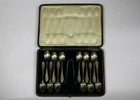 Lot 1058A - A cased set of twelve silver teaspoons and tongs