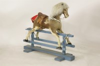 Lot 1586A - A hide upholstered small rocking horse 110cm long